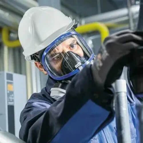 a workers wearing filter boxes and full face masks